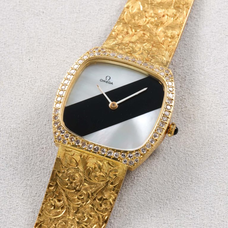 Two tone Yellow Gold MOP/Onyx dial w diamond encrusted bracelet and yellow gold/onyx crown